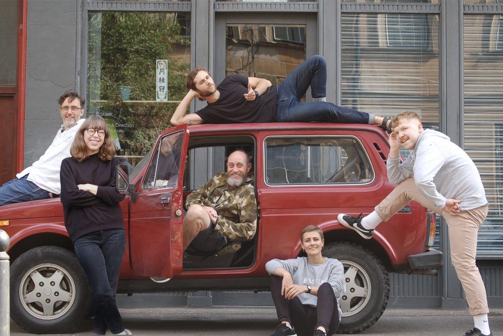 O Street Designers outside the Bank Street Studio with a Lada