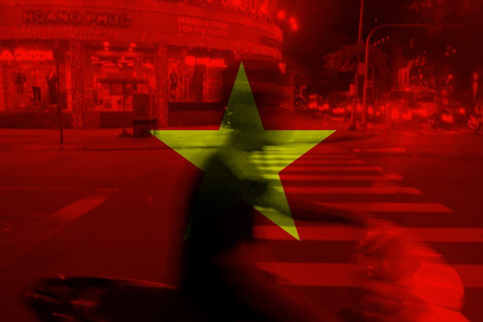 Vietnam flag overlay on a busy Saigon street